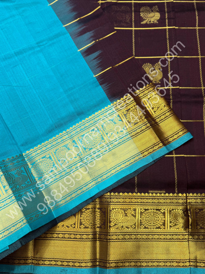 Cofee Brown with Turquoise Blue , Rich Mayil and Chakram butta in the body with Zari Checks , Traditional borders and Rich Pallu Pure Silk Cotton Saree