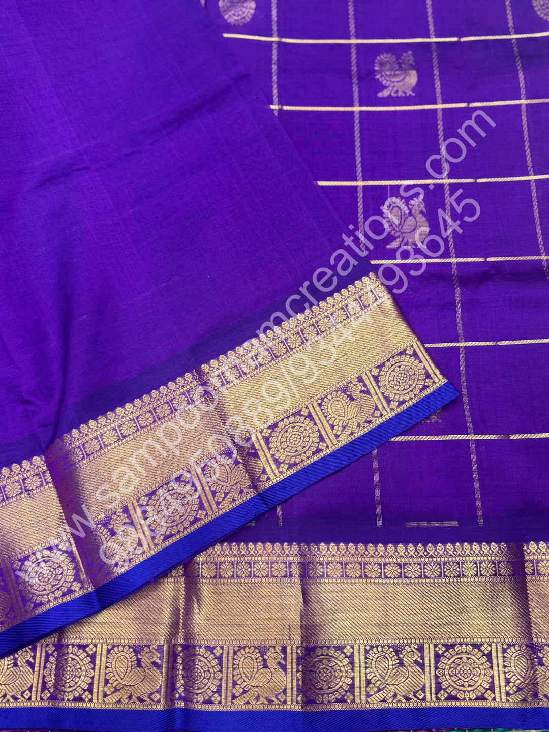 Vadamalli , Rich Mayil and Chakram butta in the body with Zari Checks , Traditional borders and Rich Pallu Pure Silk Cotton Saree