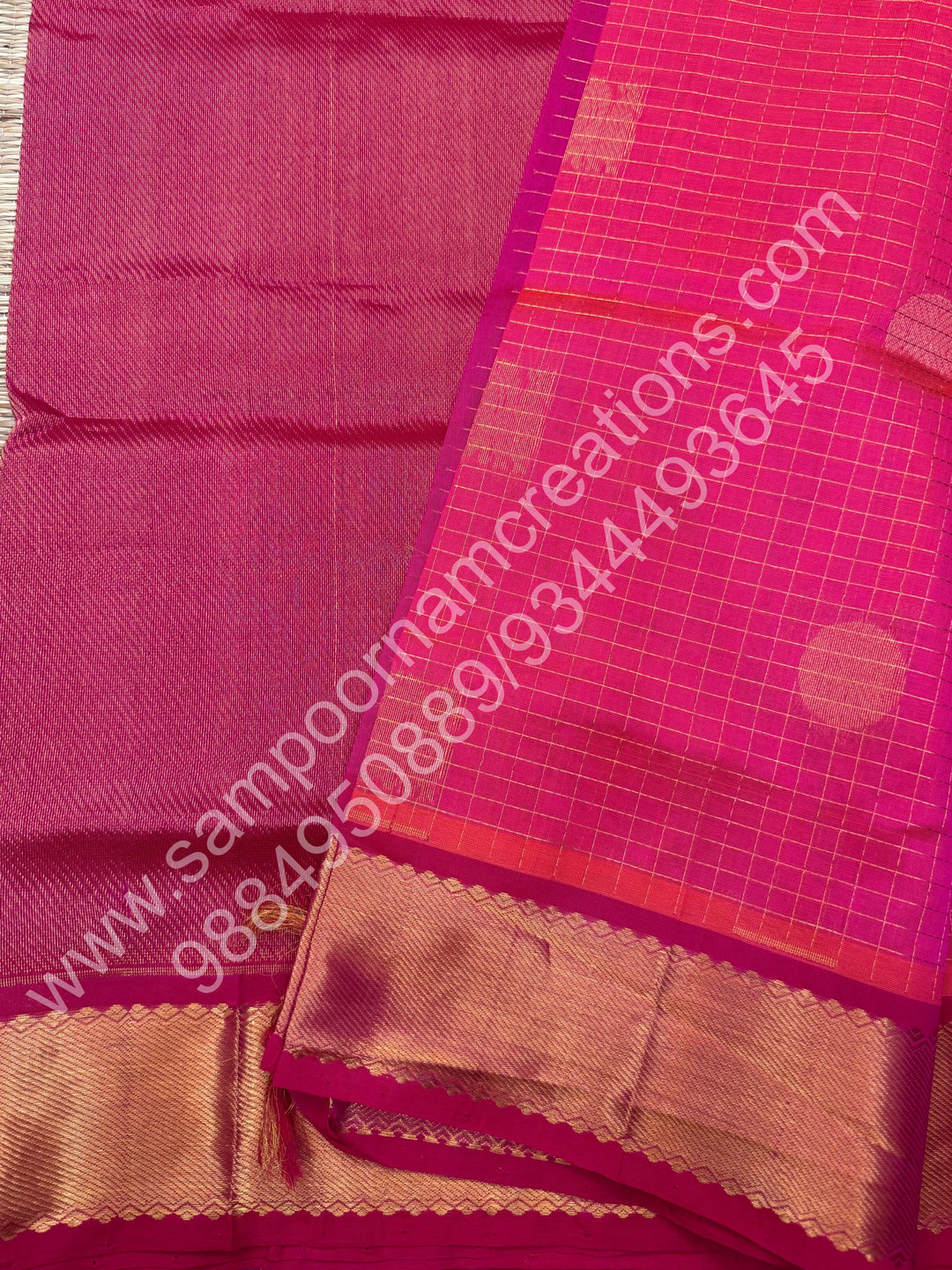 Rani Pink , Rich Mayil and Chakram butta in the body with Zari Checks , Traditional borders and Rich Pallu Pure Silk Cotton Saree
