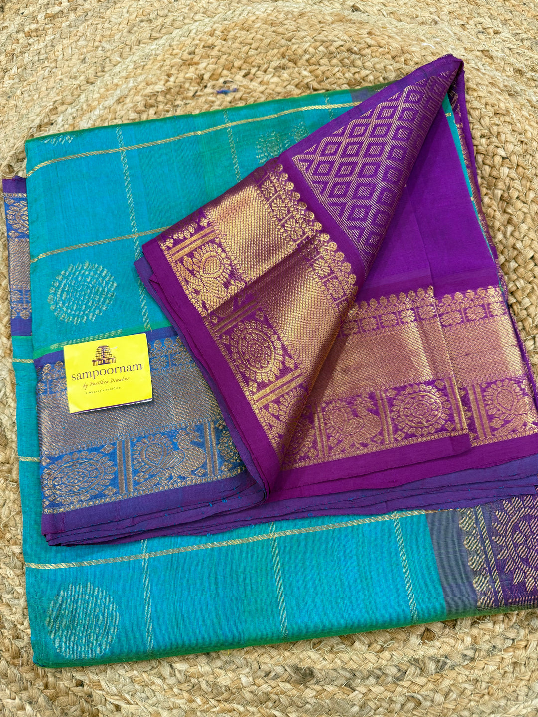 Ramar Blue with Purple  , zari kattam in the body with Mayil and Chakram butta ,traditional borders and rich Pallu Silk Cotton Saree