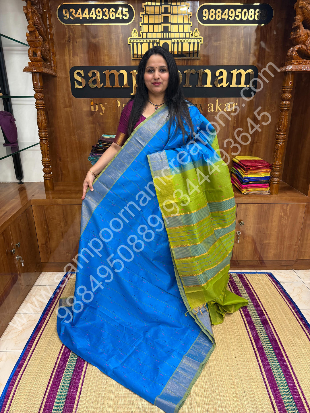 Blue with Green , checks in the body and rain drop thread butta in the body and Pallu Semi Silk Cotton Saree
