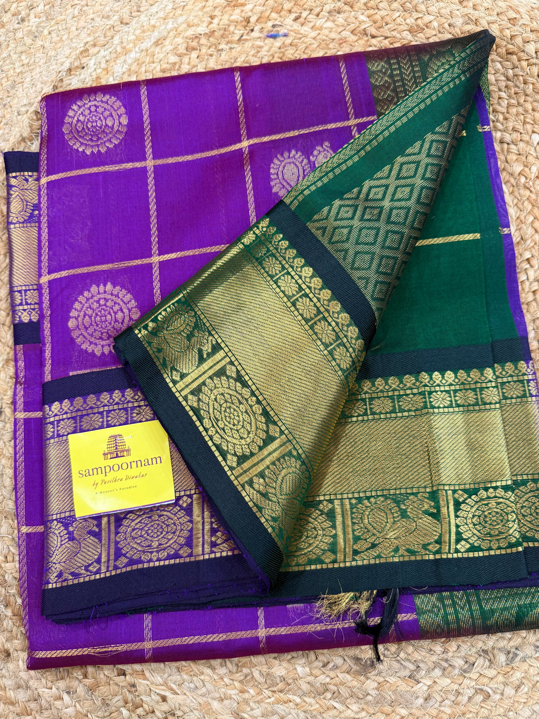 Purple with Green , Zari Kattam in the body with mayil and Chakram butta , traditional borders and rich Pallu , silk cotton saree