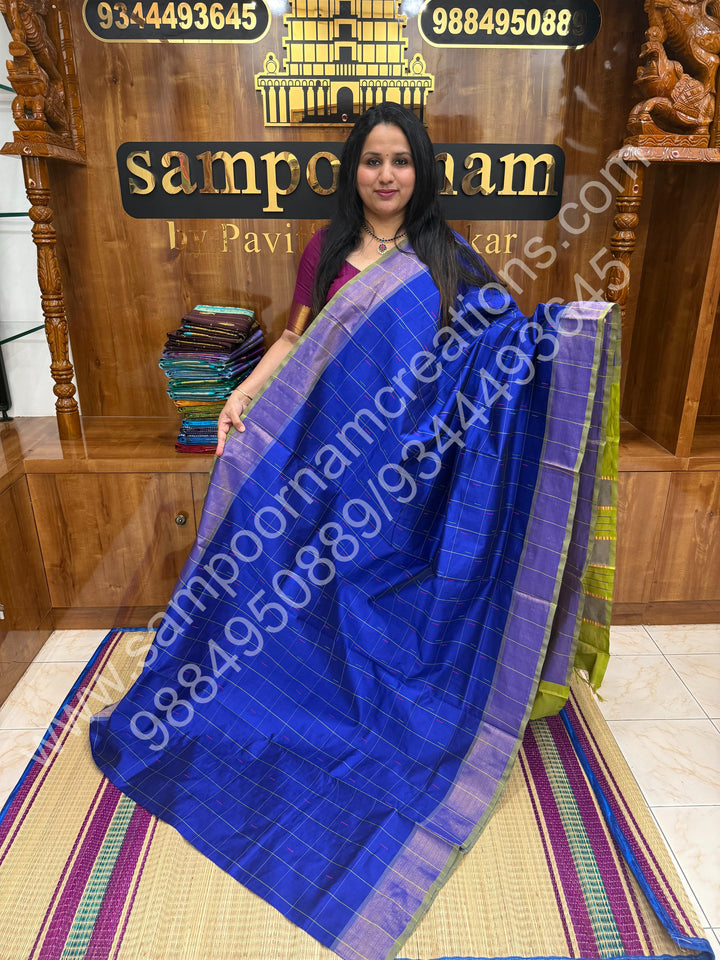Royal Blue with Green , Checks in the body with  rain drop thread butta in the body and Pallu Semi Silk Cotton Saree