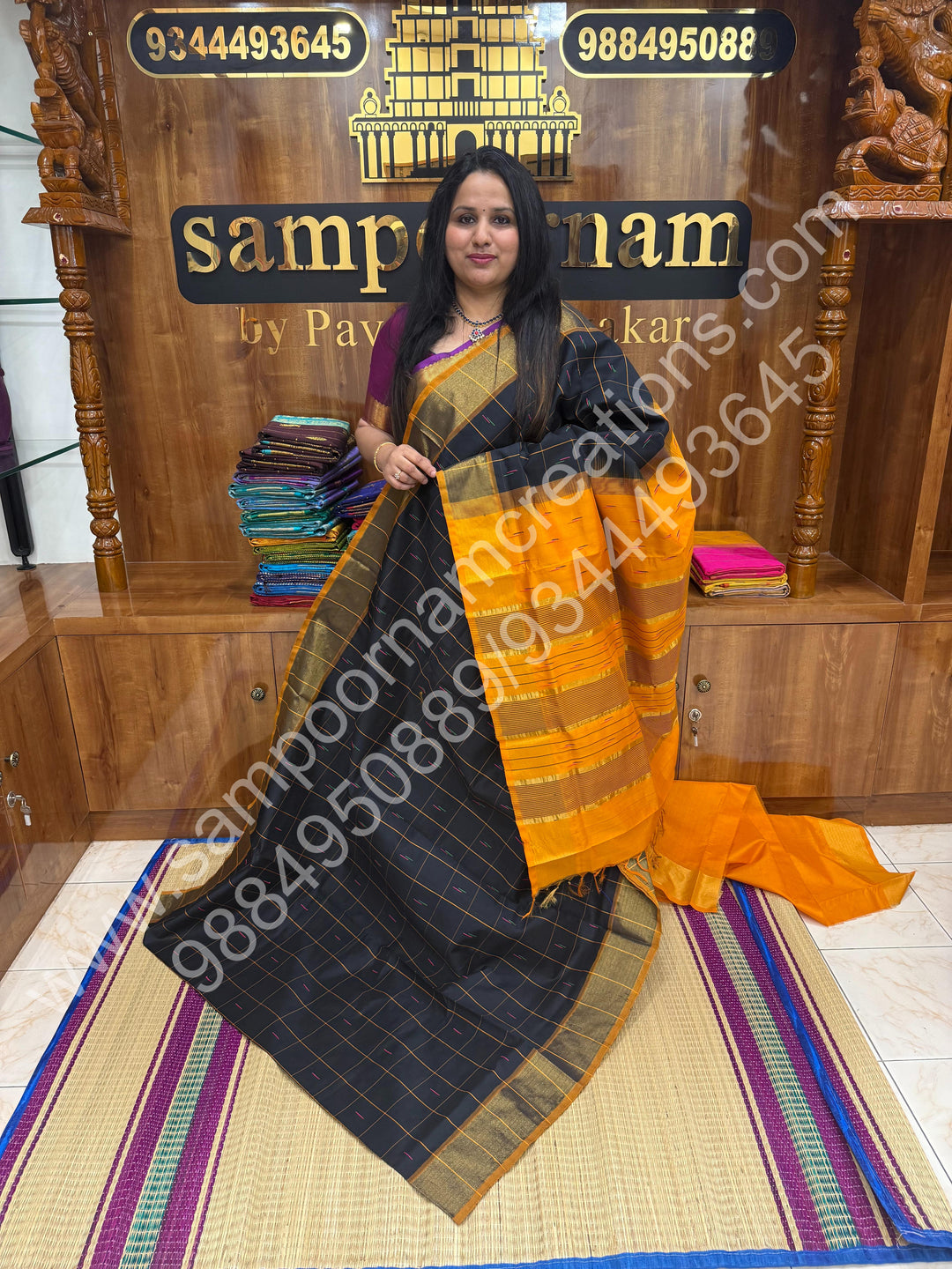 Black with Orange , checks in the body and rain drop thread butta in the body and Pallu Semi Silk Cotton Saree