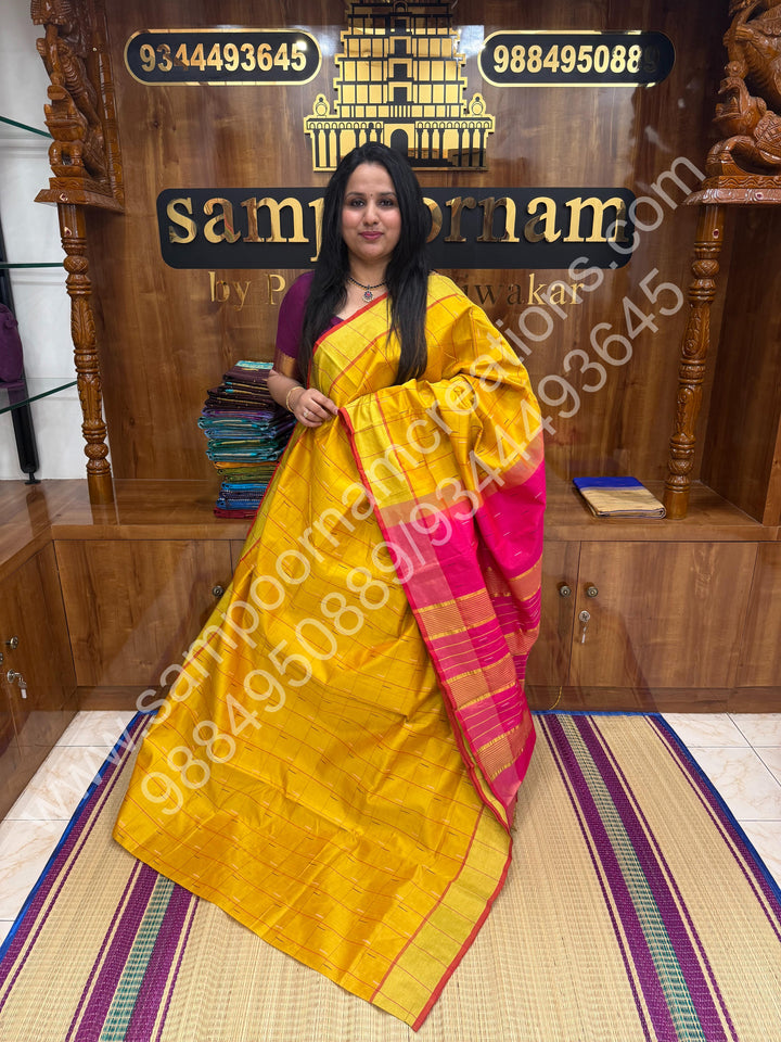 Yellow with Pink , checks in the body and rain drop thread butta in the body and Pallu Semi Silk Cotton Saree