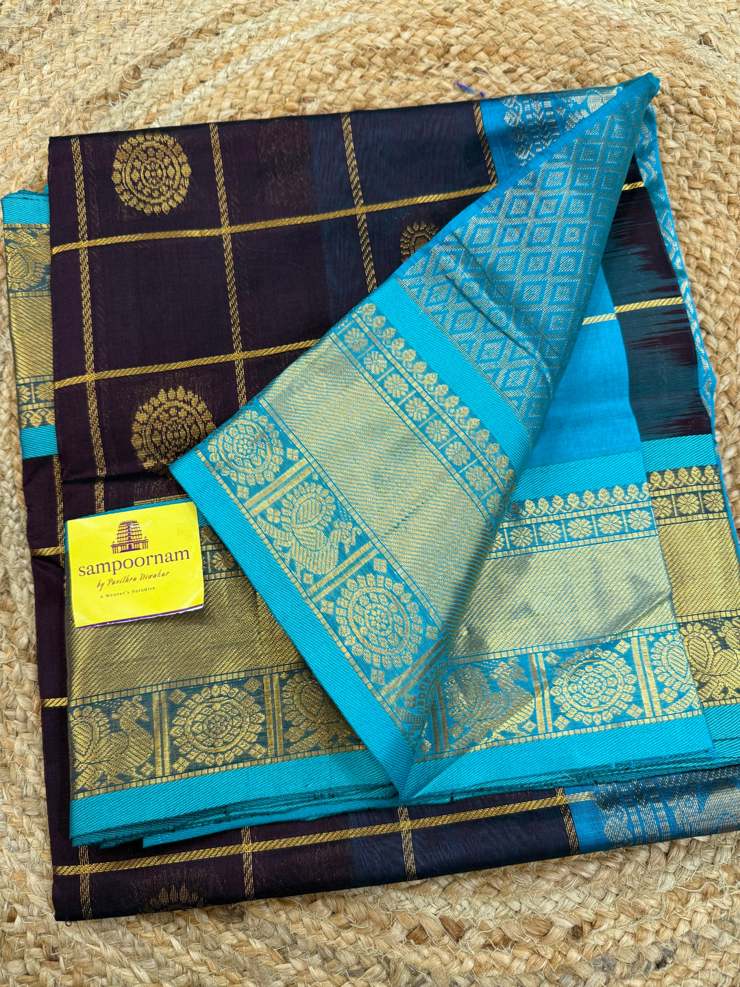 Brown with Turquoise Blue  , zari kattam in the body with Mayil and Chakram butta ,traditional borders and rich Pallu Silk Cotton Saree
