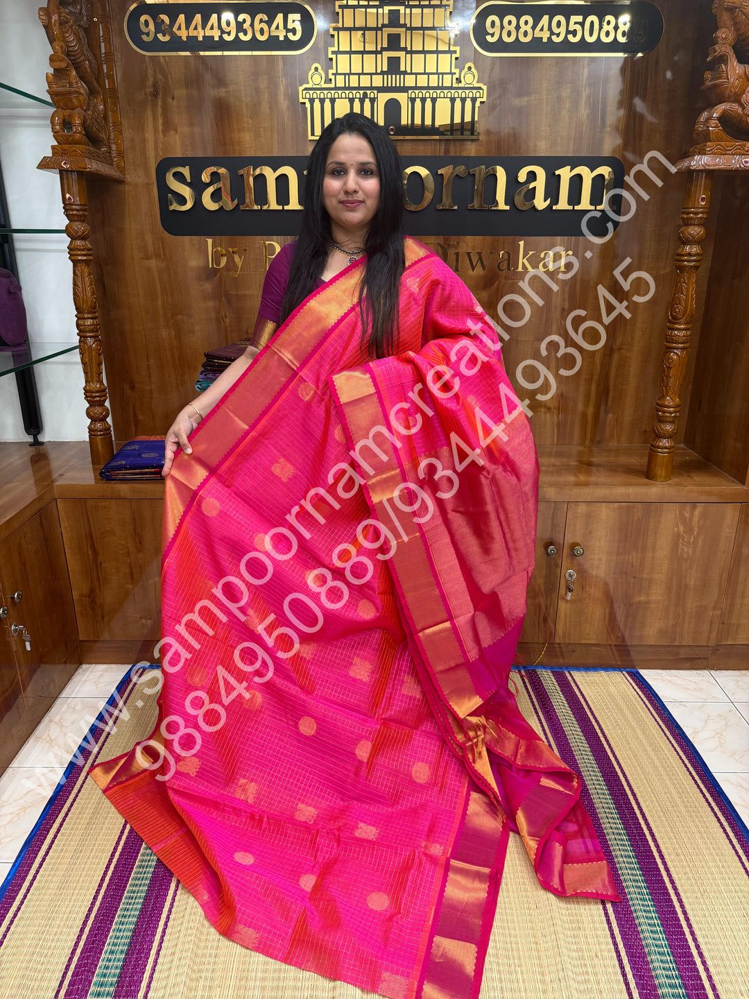 Rani Pink , Rich Mayil and Chakram butta in the body with Zari Checks , Traditional borders and Rich Pallu Pure Silk Cotton Saree
