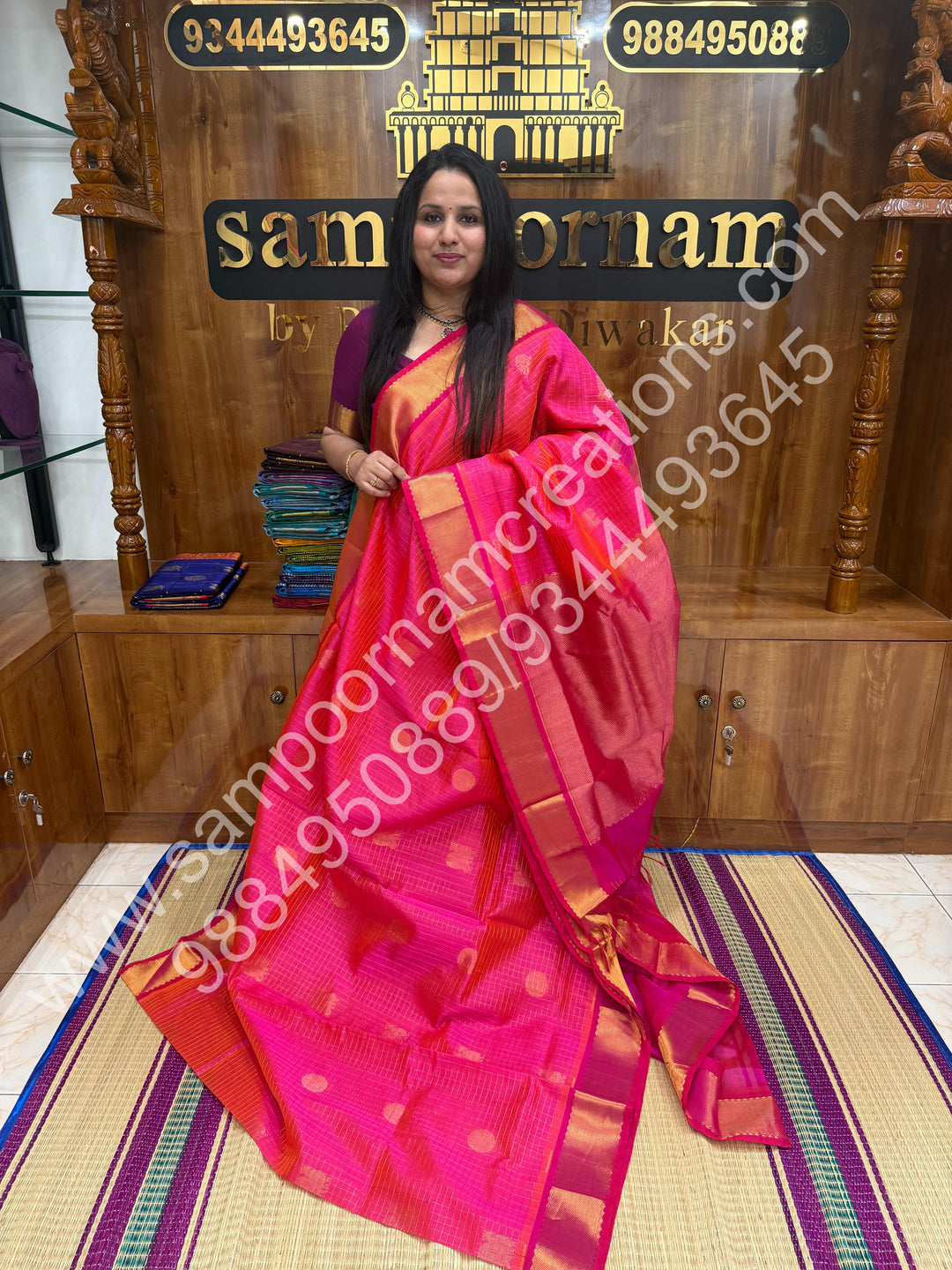 Rani Pink , Rich Mayil and Chakram butta in the body with Zari Checks , Traditional borders and Rich Pallu Pure Silk Cotton Saree