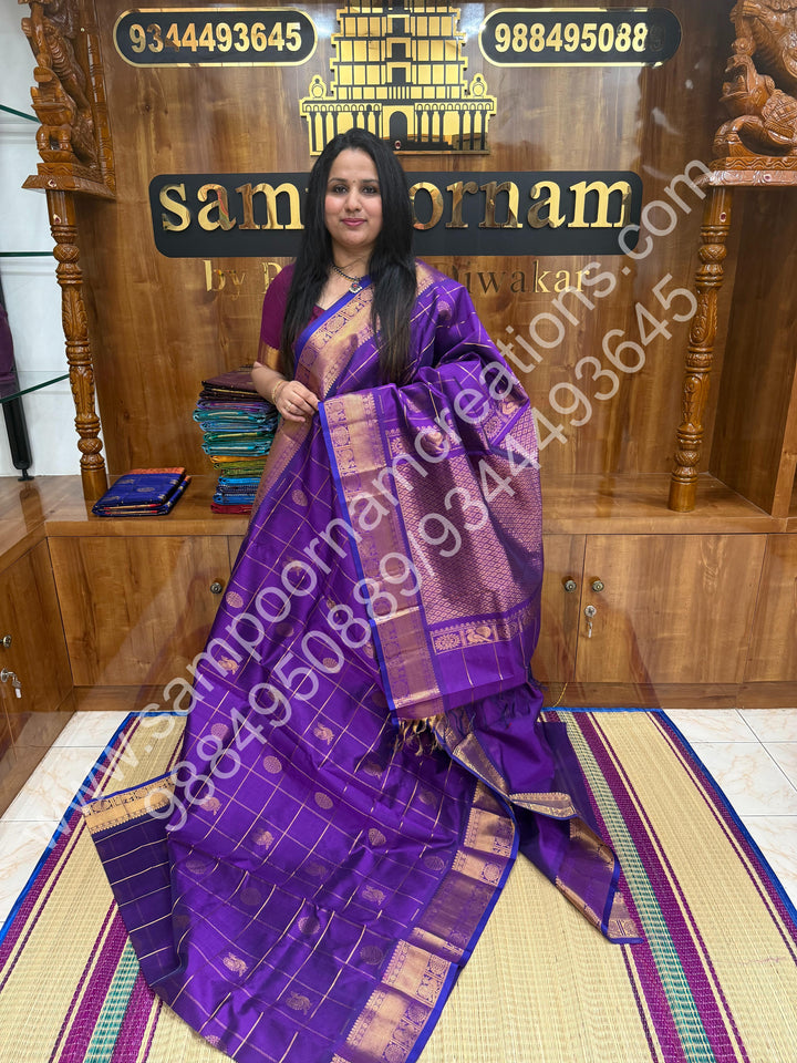 Vadamalli , Rich Mayil and Chakram butta in the body with Zari Checks , Traditional borders and Rich Pallu Pure Silk Cotton Saree