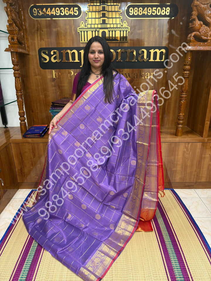 Lavender with Red , Rich Mayil and Chakram butta in the body with Zari Checks , Traditional borders and Rich Pallu Pure Silk Cotton Saree