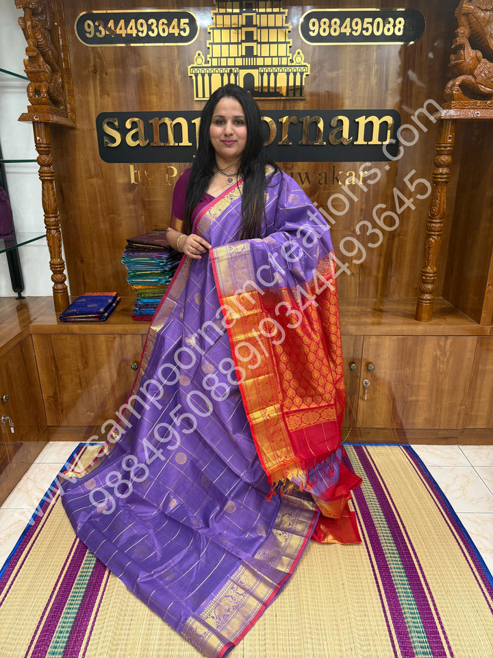 Lavender with Red , Rich Mayil and Chakram butta in the body with Zari Checks , Traditional borders and Rich Pallu Pure Silk Cotton Saree