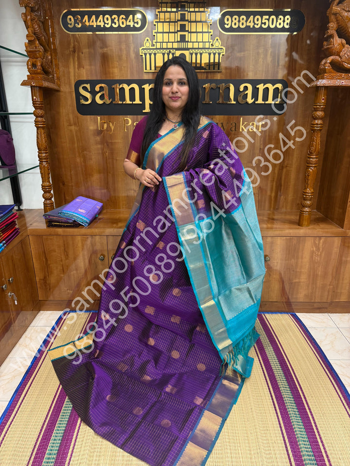 Vadamalli with Turquoise Blue , Rich Mayil and Chakram butta in the body with Zari Checks , Traditional Zari  borders and Rich Pallu Pure Silk Cotton Saree