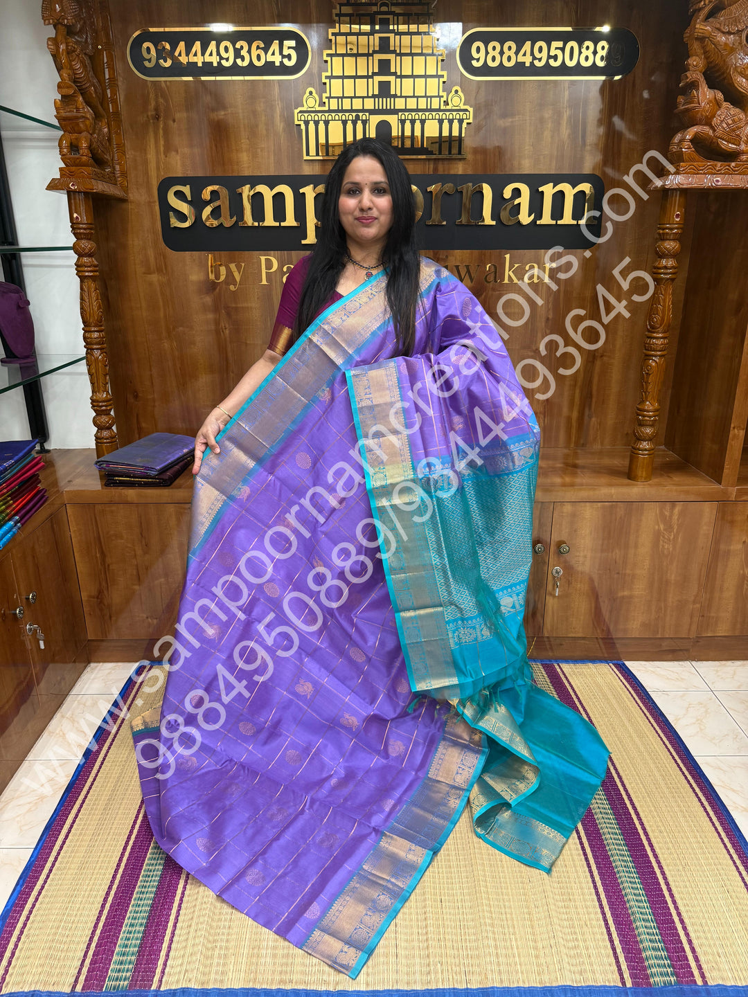Lavender with Turquoise , Rich Mayil and Chakram butta in the body with Zari Checks , Traditional borders and Rich Pallu Pure Silk Cotton Saree