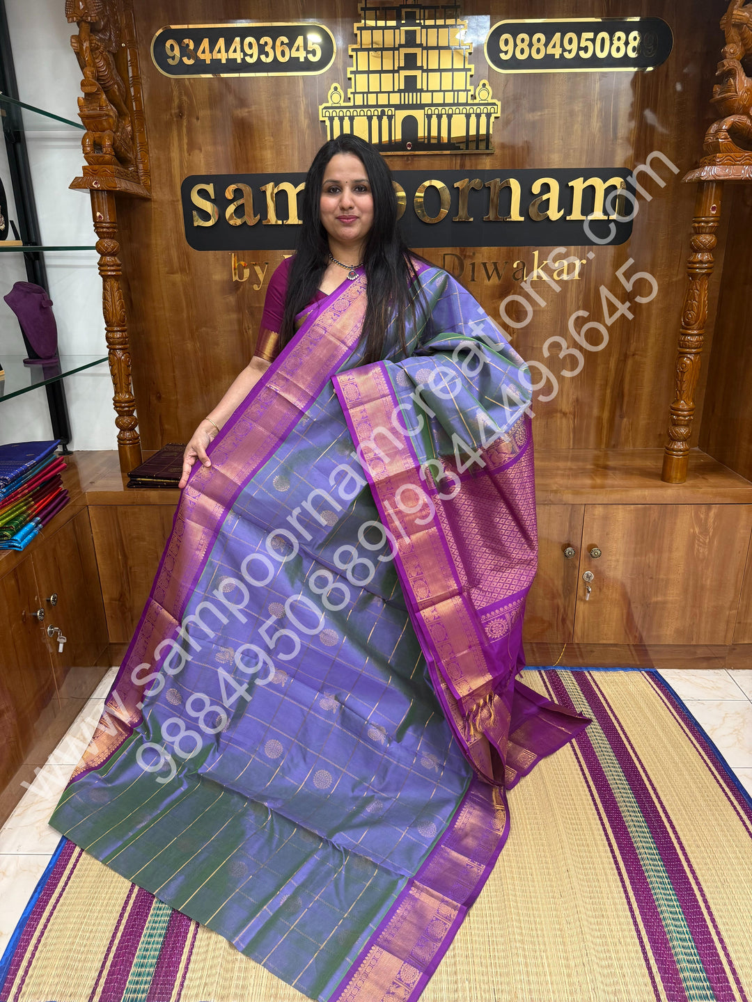 Double Shaded Lilac with Magenta , Rich Mayil and Chakram butta in the body with Zari Checks , Traditional borders and Rich Pallu Pure Silk Cotton Saree