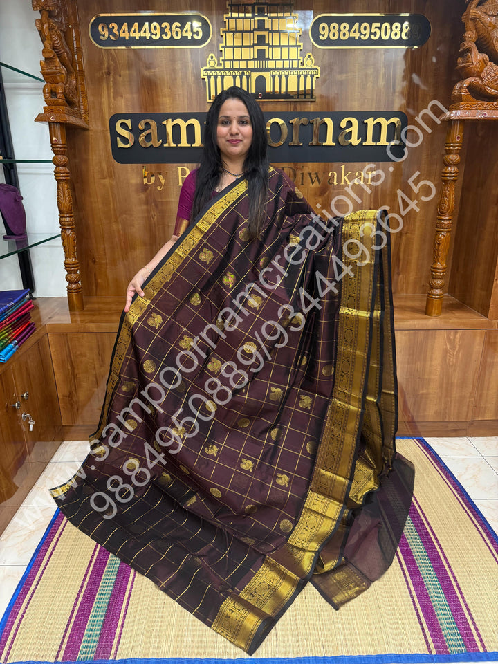 Cofee Brown , Rich Mayil and Chakram butta in the body with Zari Checks , Traditional borders and Rich Pallu Pure Silk Cotton Saree