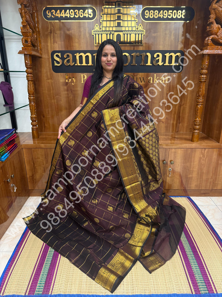 Cofee Brown , Rich Mayil and Chakram butta in the body with Zari Checks , Traditional borders and Rich Pallu Pure Silk Cotton Saree