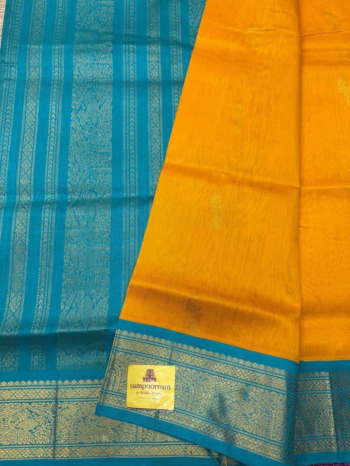 Mambazha Manjal with Turquoise Blue  , Rich Mayil Zari Butta in the body and  Traditional borders and Rich Pallu Korvai Silk Cotton Saree