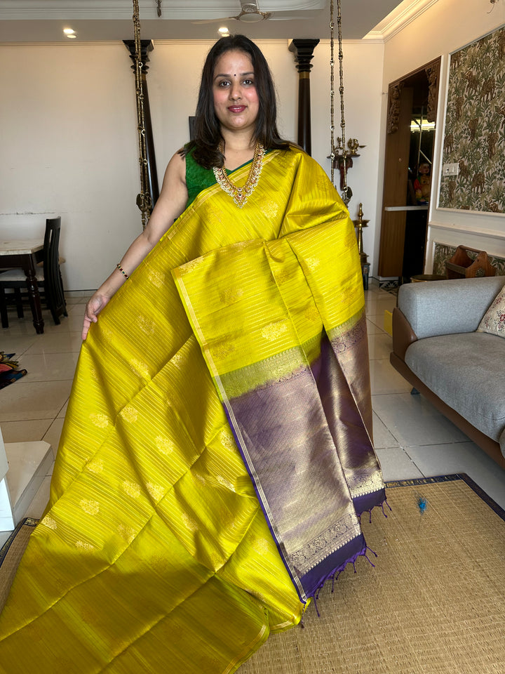 Lemon Yellow with Purple Rich Body with Silver and Gold Zari Lines and Rich Zari Butta with A Grand Pallu Pure Soft Silk Saree