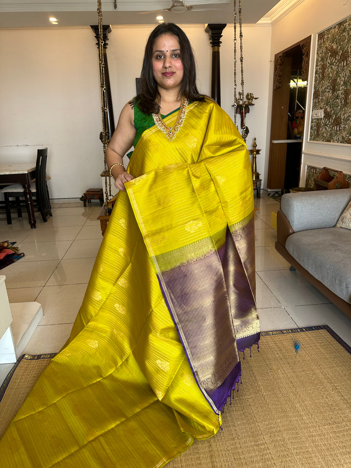 Lemon Yellow with Purple Rich Body with Silver and Gold Zari Lines and Rich Zari Butta with A Grand Pallu Pure Soft Silk Saree