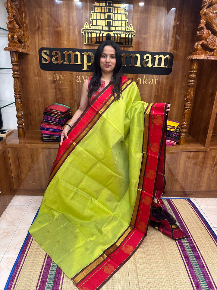 Parrot Green with Maroon ,  Rich Mayil Zari Butta in the body , Annam motif in the  border and , Rich Pallu Korvai Silk Cotton Saree
