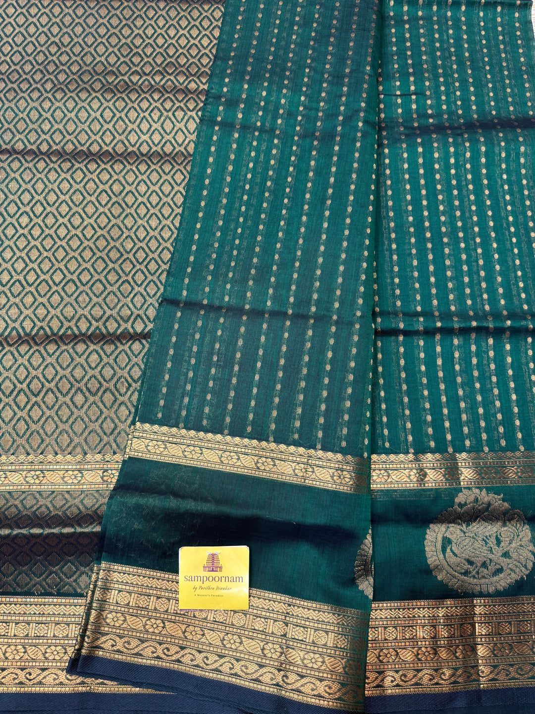 Dark Green ,  Rich Zari butta in the body , Rettapet borders with Bird Zari Motif  and Rich Pallu Silk Cotton Saree