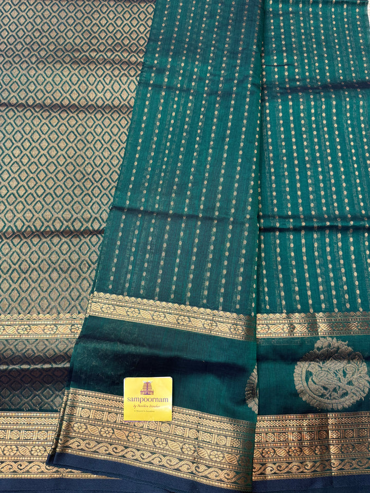Dark Green ,  Rich Zari butta in the body , Rettapet borders with Bird Zari Motif  and Rich Pallu Silk Cotton Saree