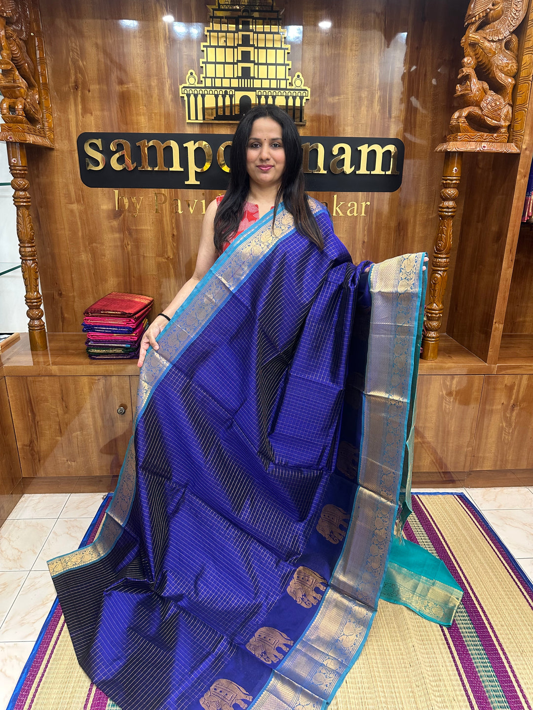 Blue with Turquoise Blue , Zari Checks in the body with One side Elephant Motif in the borders , Rich Pallu Silk Cotton Saree