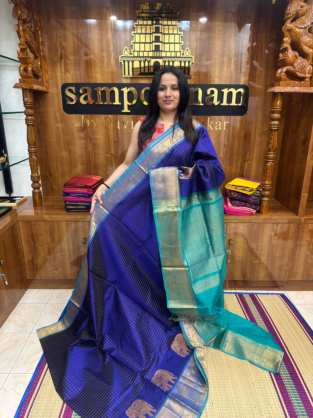 Blue with Turquoise Blue , Zari Checks in the body with One side Elephant Motif in the borders , Rich Pallu Silk Cotton Saree