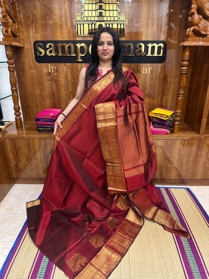 Arakku, Zari Checks in the body with One side Elephant Motif in the borders , Rich Pallu ,Silk Cotton Saree