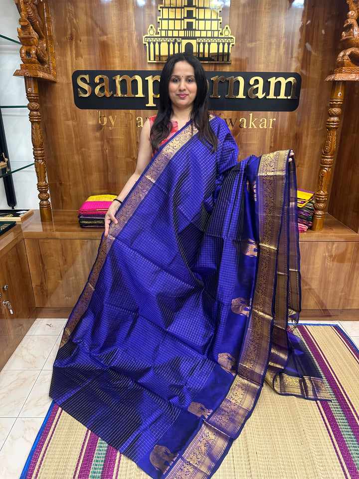 Indigo Blue , Zari Checks in the body with One side Elephant Motif in the borders , Rich Pallu ,Silk Cotton Saree