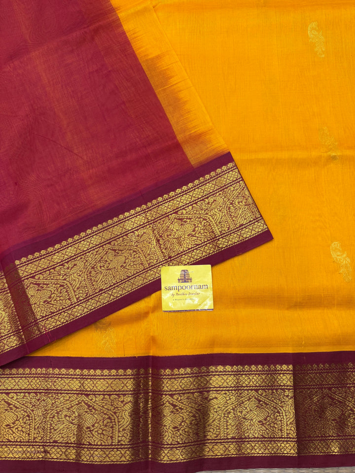 Mambazha Manjal with Red , Rich Mayil Zari Butta in the body and  Traditional borders and Rich Pallu Korvai Silk Cotton Saree