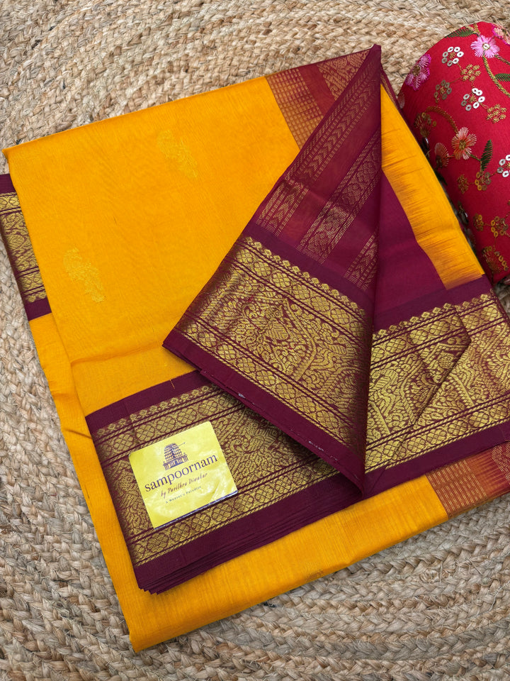 Mambazha Manjal with Red , Rich Mayil Zari Butta in the body and  Traditional borders and Rich Pallu Korvai Silk Cotton Saree