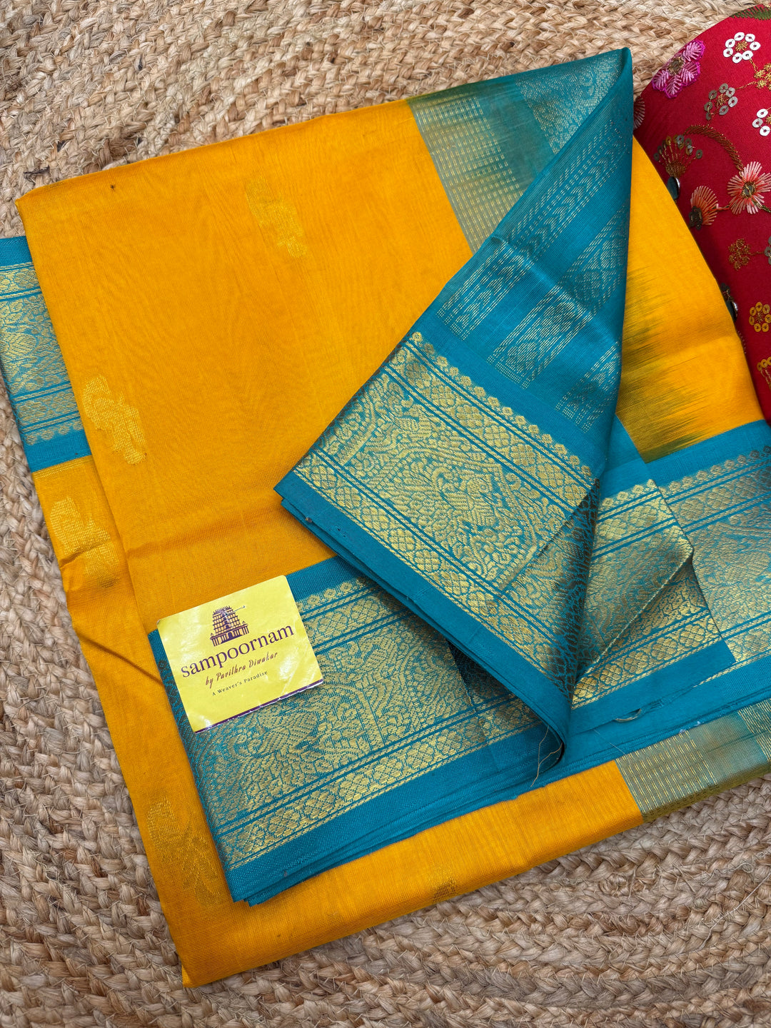 Mambazha Manjal with Turquoise Blue  , Rich Mayil Zari Butta in the body and  Traditional borders and Rich Pallu Korvai Silk Cotton Saree