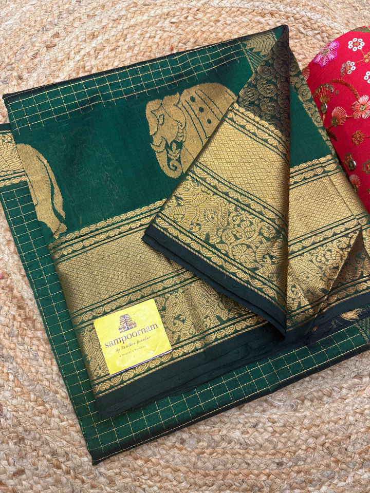 Dark Green , Zari Checks in the body with One side Elephant Motif in the borders , Rich Pallu ,Silk Cotton Saree