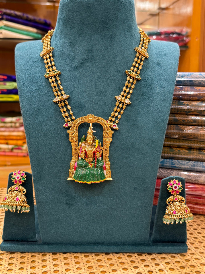 A classic three layer beaded neck piece with gold balls , red , green and white kemp stones , with Goddess Kamakshi Amman 3D Pendant .