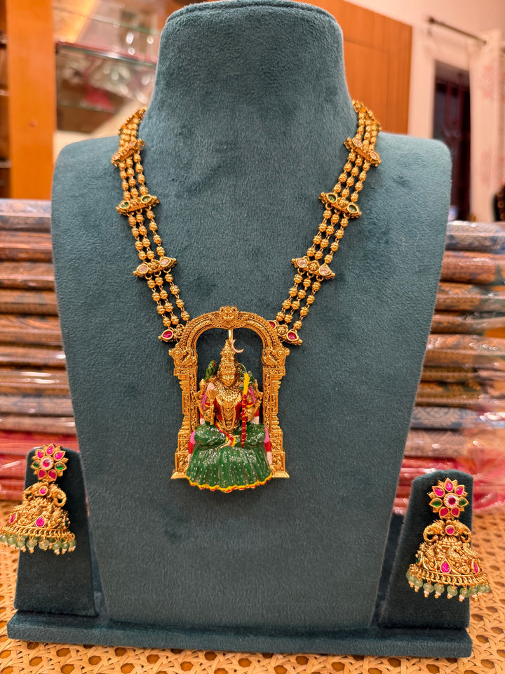 A classic three layer beaded neck piece with gold balls , red , green and white kemp stones , with Goddess Kamakshi Amman 3D Pendant .