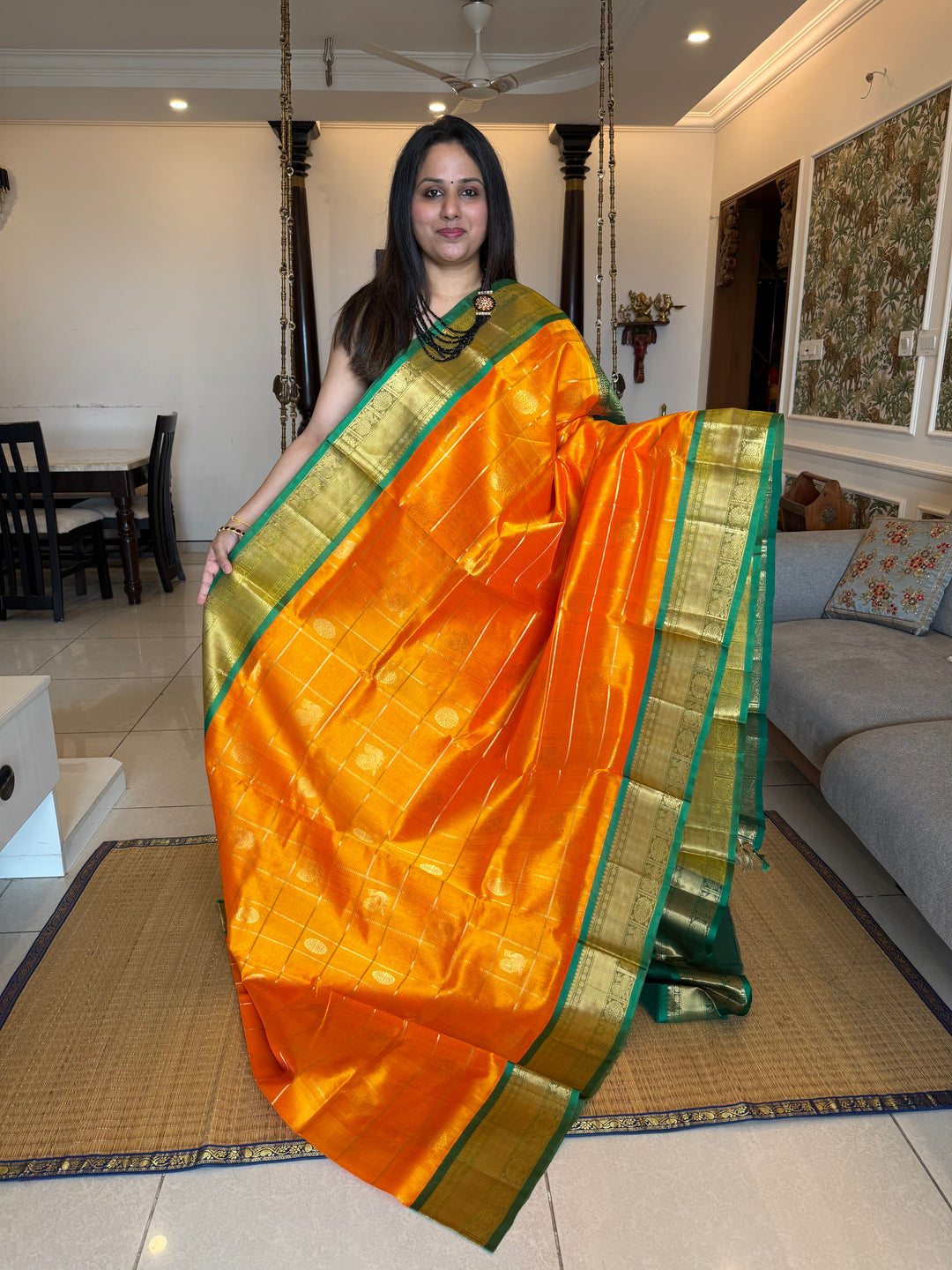 Mambazha Manjal with Green  , zari kattam in the body with Mayil and Chakram butta ,traditional borders and rich Pallu Silk Cotton Saree