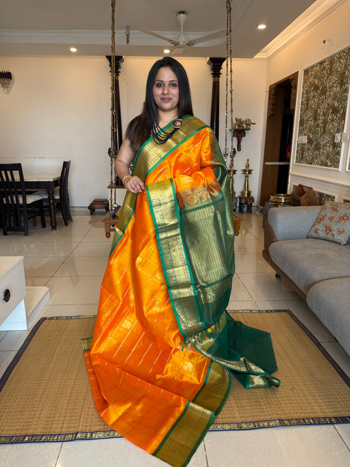Mambazha Manjal with Green  , zari kattam in the body with Mayil and Chakram butta ,traditional borders and rich Pallu Silk Cotton Saree