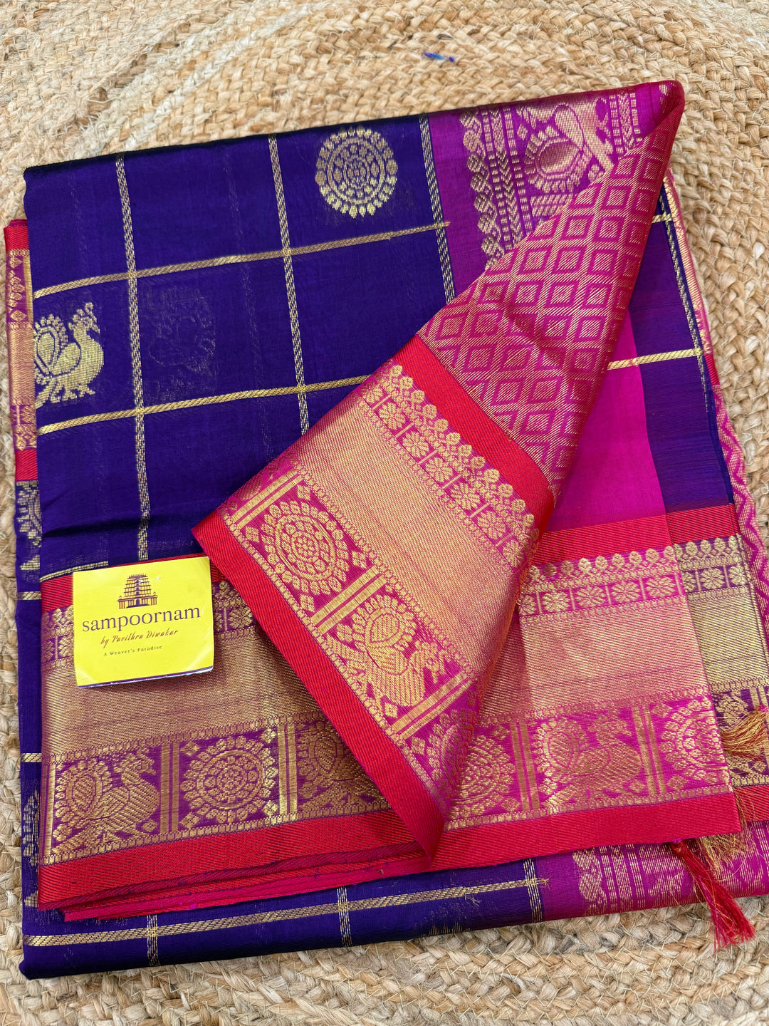 Purple with Pink , Red Selvedge  , zari kattam in the body with Mayil and Chakram butta ,traditional borders and rich Pallu Silk Cotton Saree