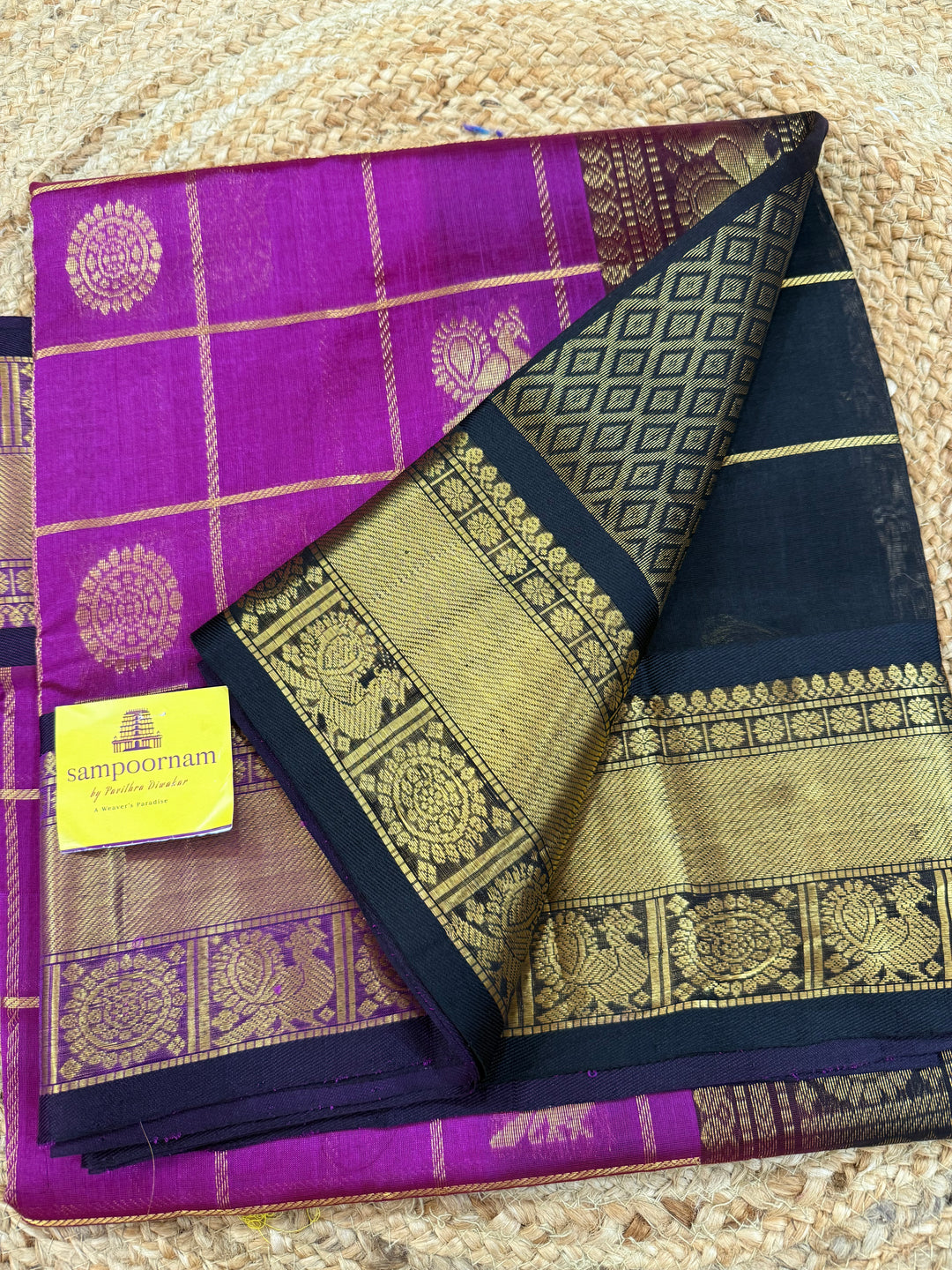Magenta with Black  , zari kattam in the body with Mayil and Chakram butta ,traditional borders and rich Pallu Silk Cotton Saree