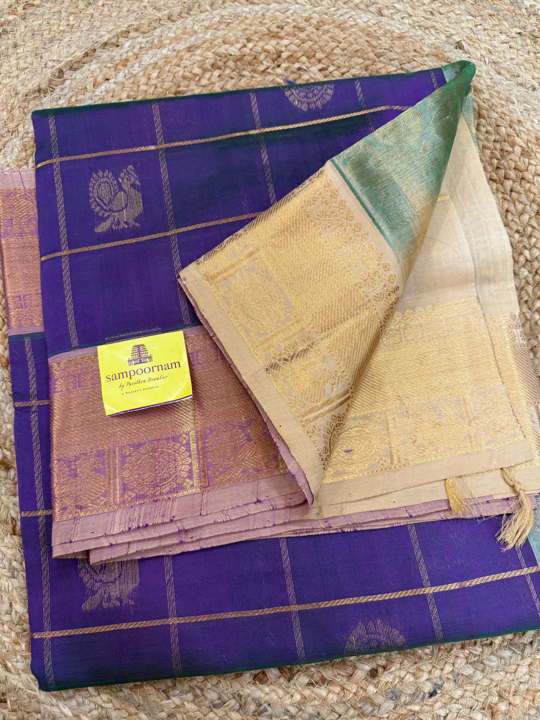 Double shaded Purple with Biscuit colour  , zari kattam in the body with Mayil and Chakram butta ,traditional borders and rich Pallu Silk Cotton Saree