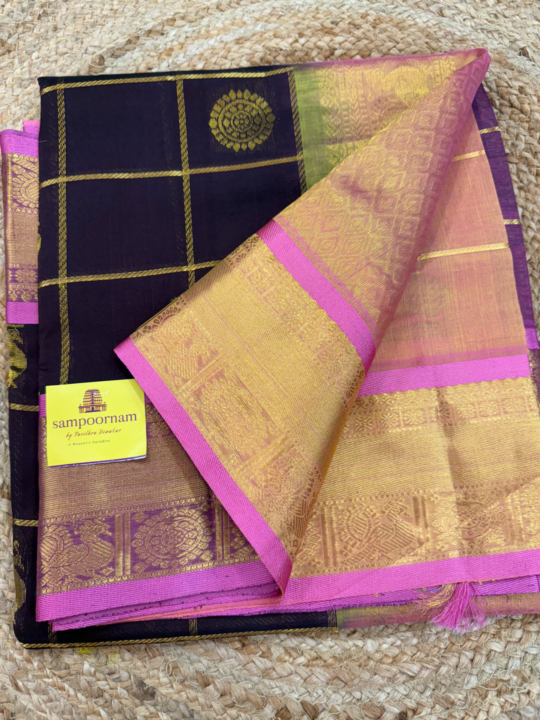 Dark Brown with Peachish Pink colour ,Baby Pink selvedge , zari kattam in the body with Mayil and Chakram butta ,traditional borders and rich Pallu Silk Cotton Saree