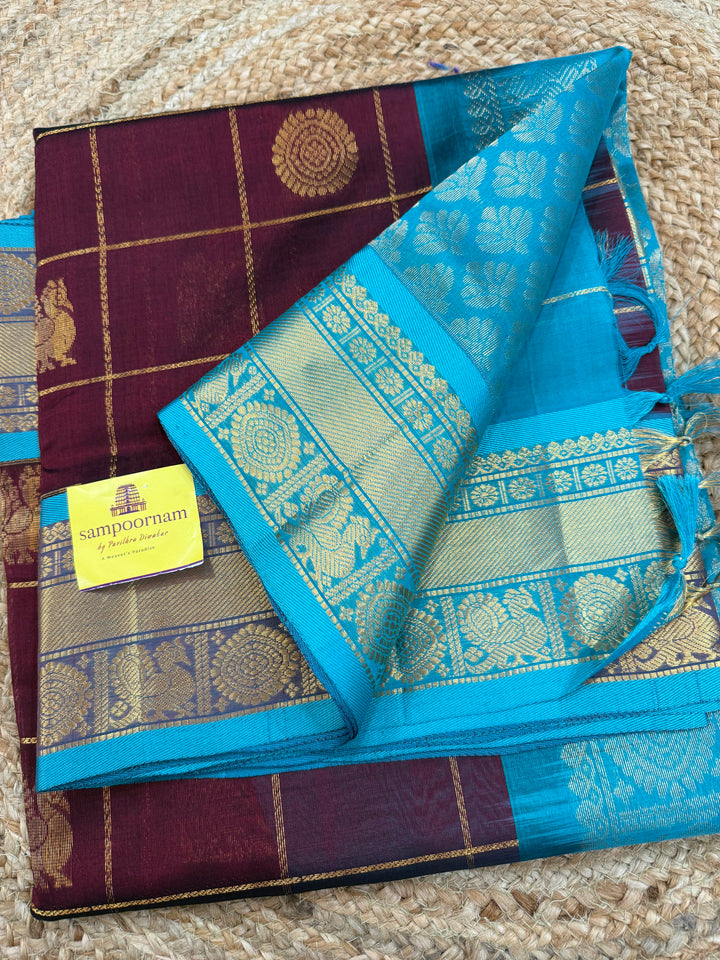 Maroon with Turquoise Blue  , zari kattam in the body with Mayil and Chakram butta ,traditional borders and rich Pallu Silk Cotton Saree