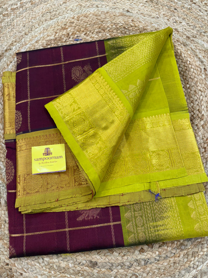 Maroon with Lemon Green  , zari kattam in the body with Mayil and Chakram butta ,traditional borders and rich Pallu Silk Cotton Saree