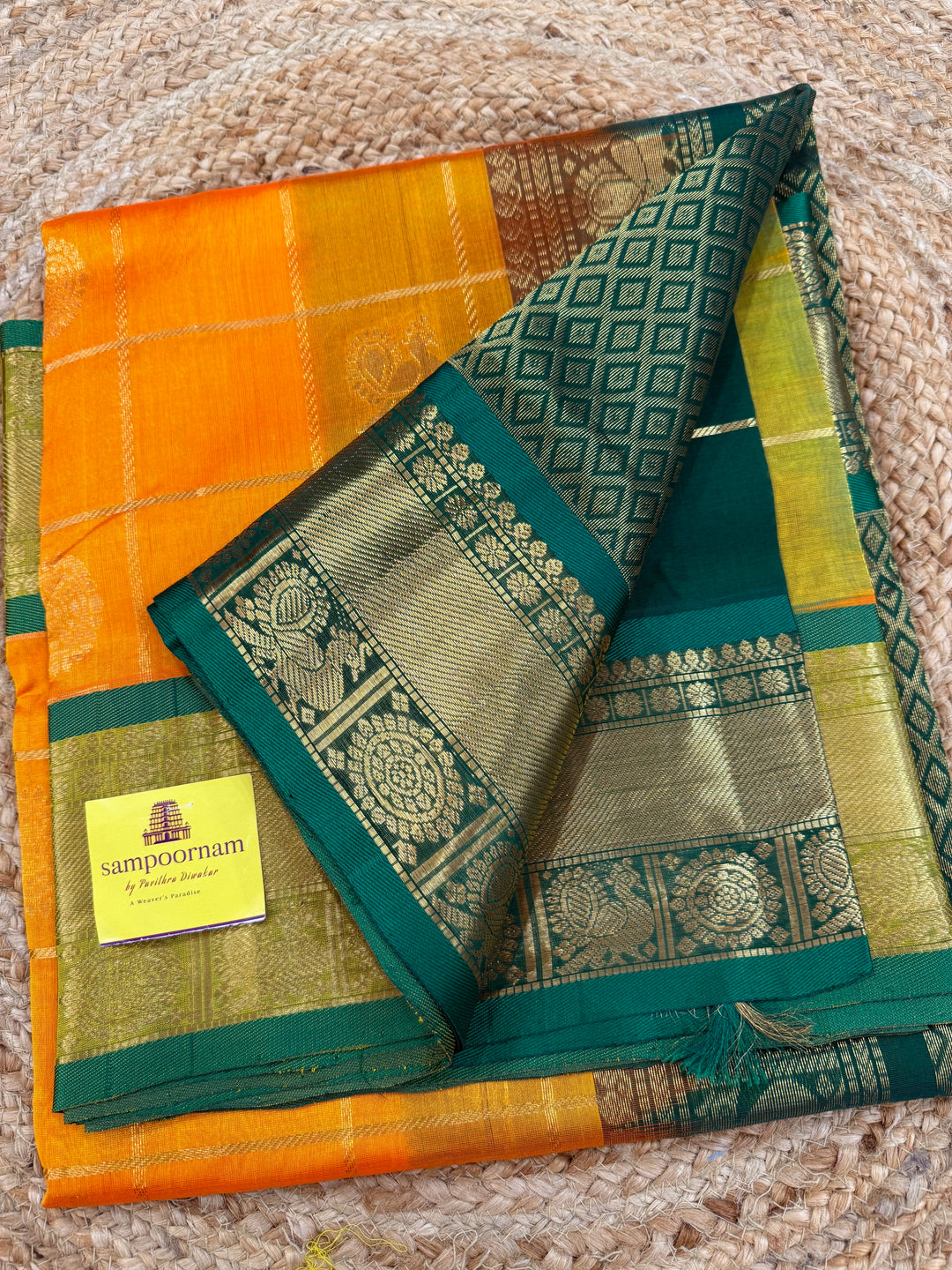 Mambazha Manjal with Green  , zari kattam in the body with Mayil and Chakram butta ,traditional borders and rich Pallu Silk Cotton Saree