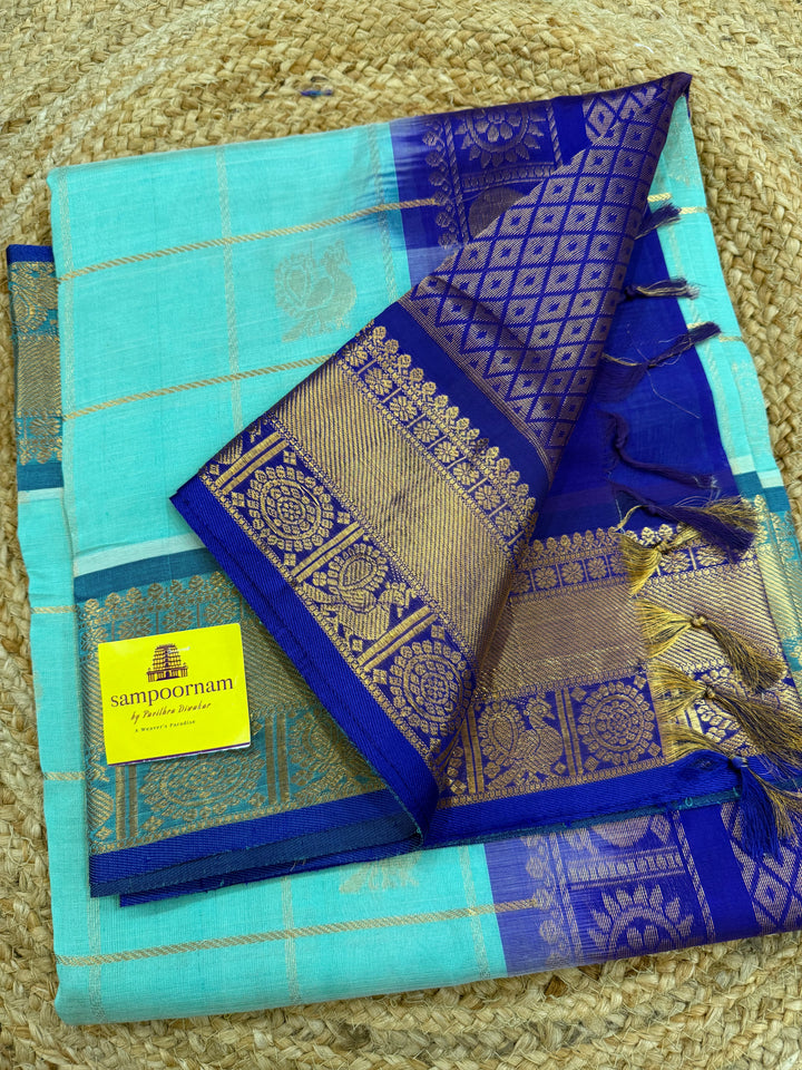Light Blue with Dark Blue  , zari kattam in the body with Mayil and Chakram butta ,traditional borders and rich Pallu Silk Cotton Saree