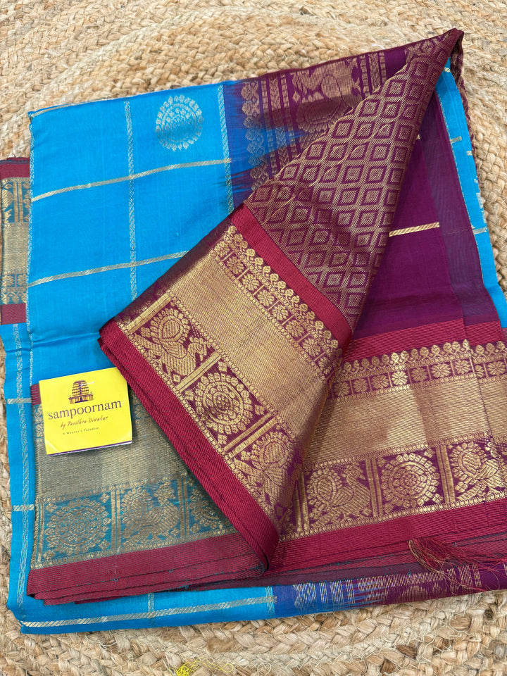 Ramar Blue with Maroon colour , zari kattam in the body with Mayil and Chakram butta ,traditional borders and rich Pallu Silk Cotton Saree