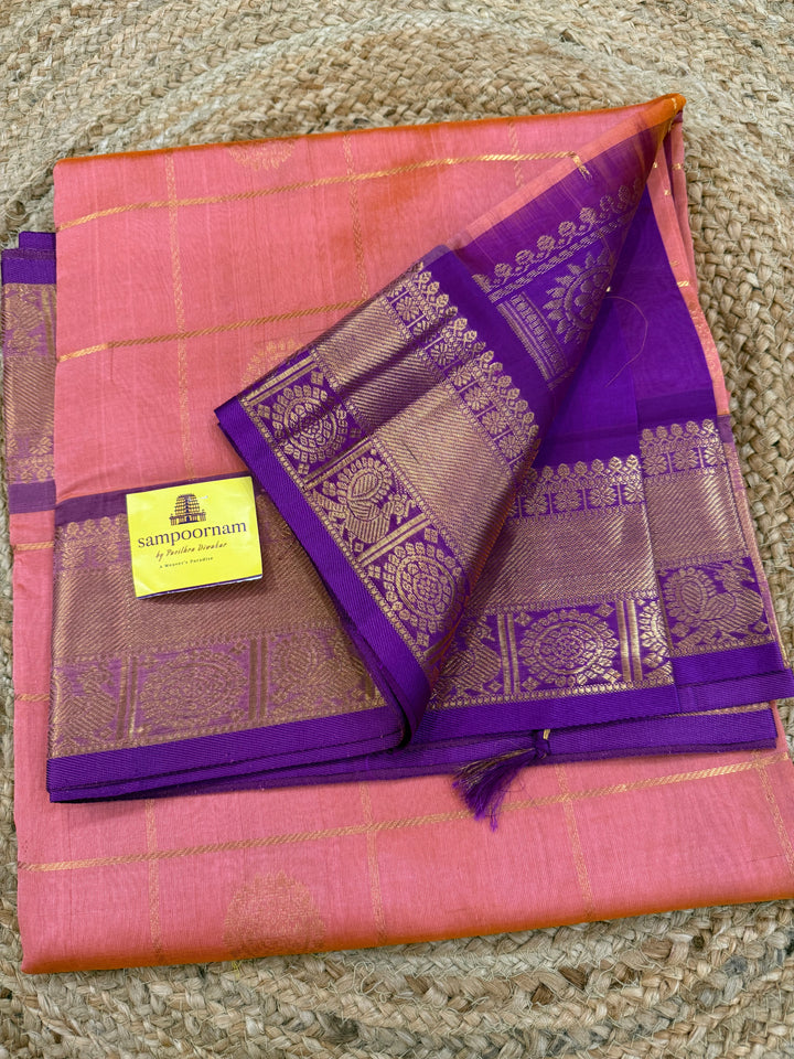 Light Kanakambaram with Purple , zari kattam in the body with Mayil and Chakram butta ,traditional borders and rich Pallu Silk Cotton Saree