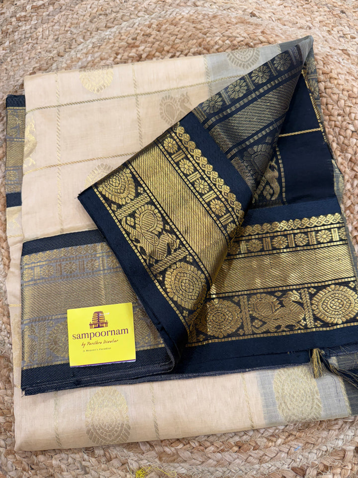 Cream with Black  , zari kattam in the body with Mayil and Chakram butta ,traditional borders and rich Pallu Silk Cotton Saree