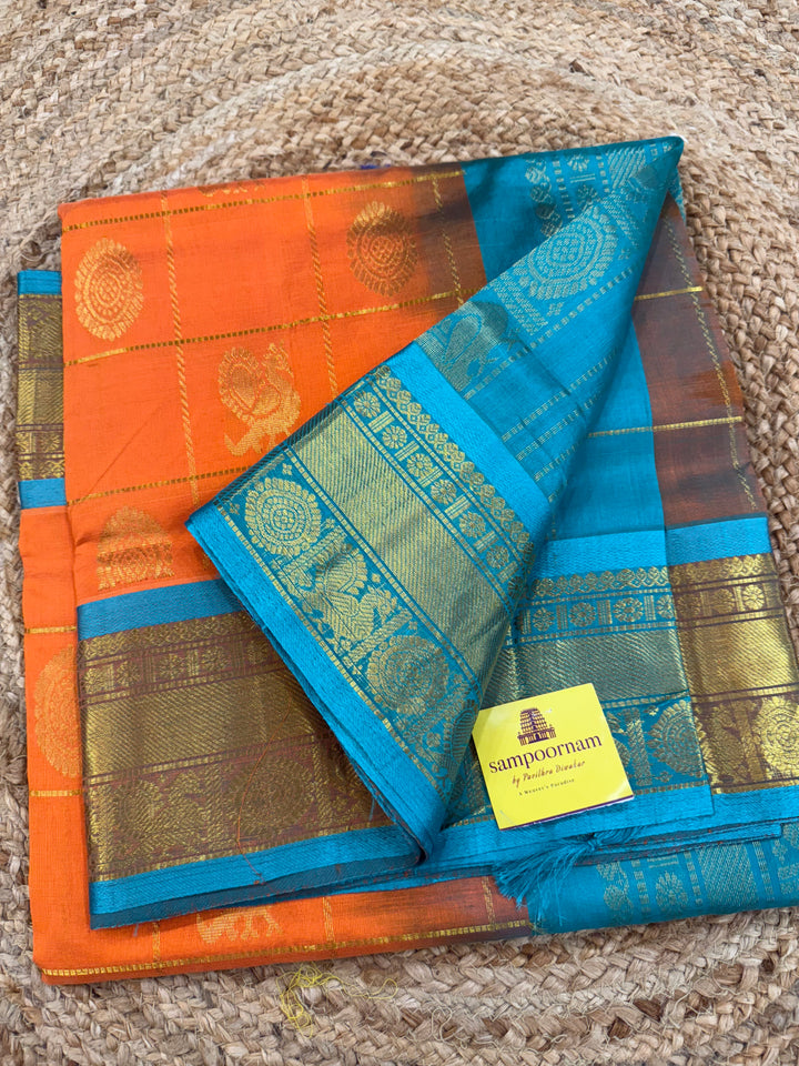 Orange with Turquoise Blue colour , zari kattam in the body with Mayil and Chakram butta ,traditional borders and rich Pallu Silk Cotton Saree
